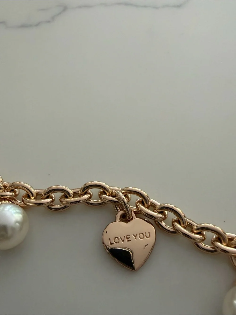 Bag Chain - gold tone with faux pearls and hearts that say “ Iove you”